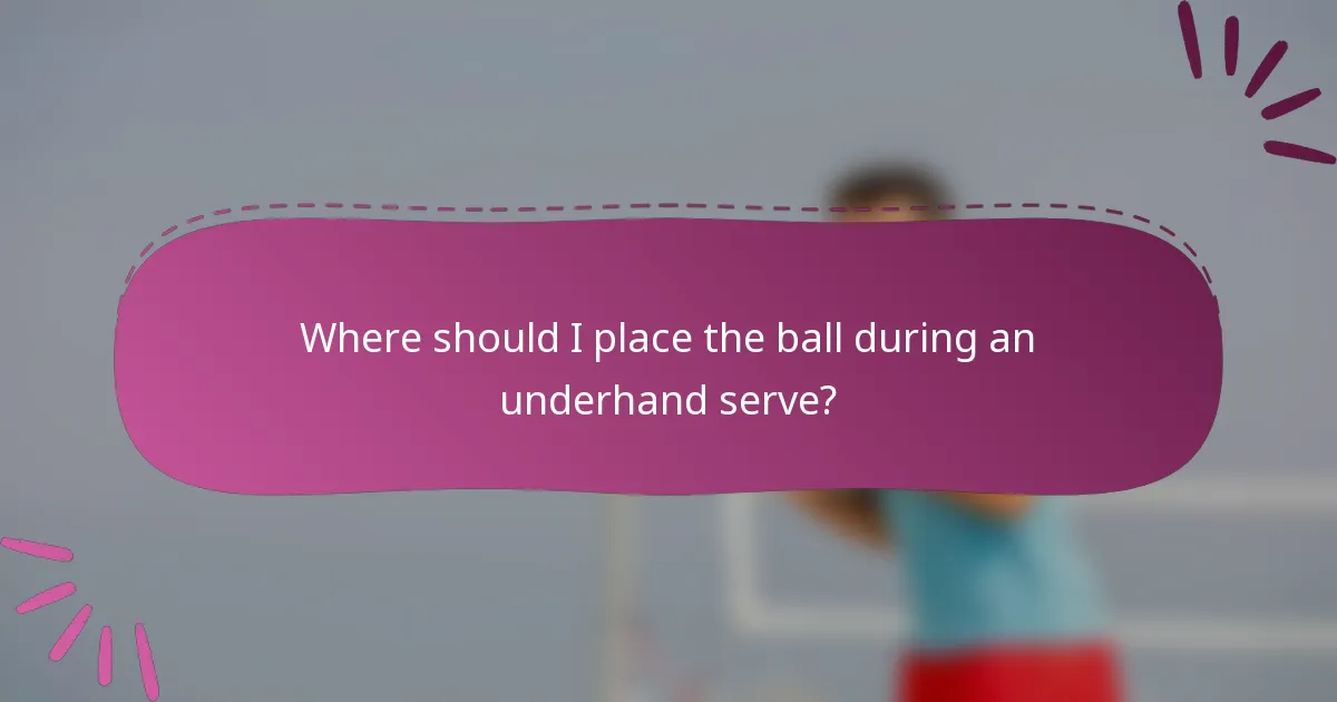 Where should I place the ball during an underhand serve?